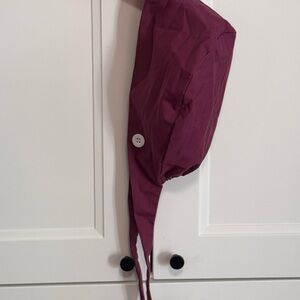 Burgundy scrub cap.